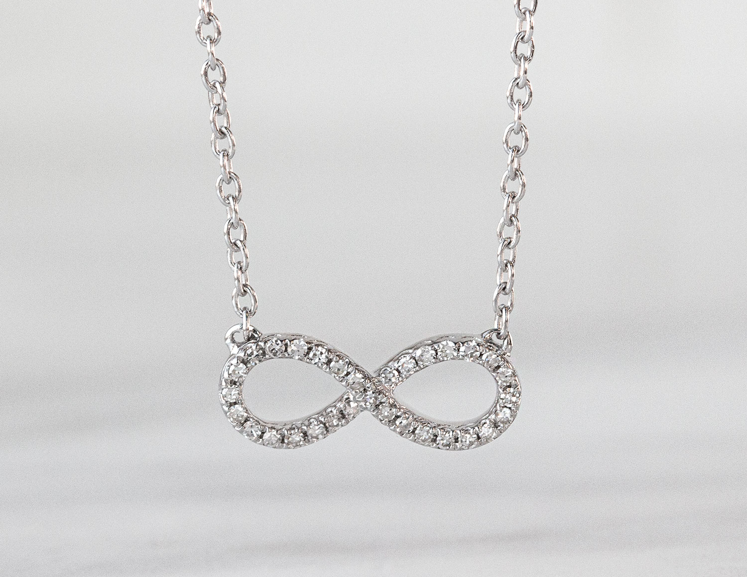 Kesslers 1/10ct. t.w. Diamond Infinity Necklace in Sterling Silver